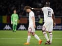 Paris Saint-Germain's French defender Edouard Michut (L) leaves the pitch after receiving a red card during the French L1 football match between Angers SCO and Paris Saint-Germain at the Raymond-Kopa Stadium in Angers, north-western France on April 20, 2022. (Photo by LOIC VENANCE / AFP) (Photo by LOIC VENANCE/AFP via Getty Images)