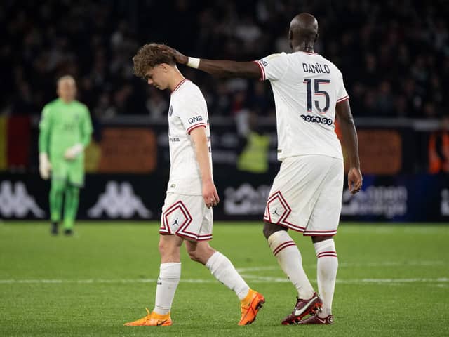 Paris Saint-Germain's French defender Edouard Michut (L) leaves the pitch after receiving a red card during the French L1 football match between Angers SCO and Paris Saint-Germain at the Raymond-Kopa Stadium in Angers, north-western France on April 20, 2022. (Photo by LOIC VENANCE / AFP) (Photo by LOIC VENANCE/AFP via Getty Images)