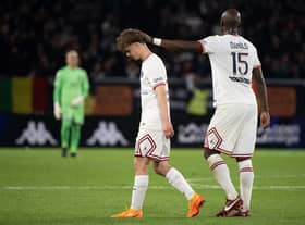 Paris Saint-Germain's French defender Edouard Michut (L) leaves the pitch after receiving a red card during the French L1 football match between Angers SCO and Paris Saint-Germain at the Raymond-Kopa Stadium in Angers, north-western France on April 20, 2022. (Photo by LOIC VENANCE / AFP) (Photo by LOIC VENANCE/AFP via Getty Images)