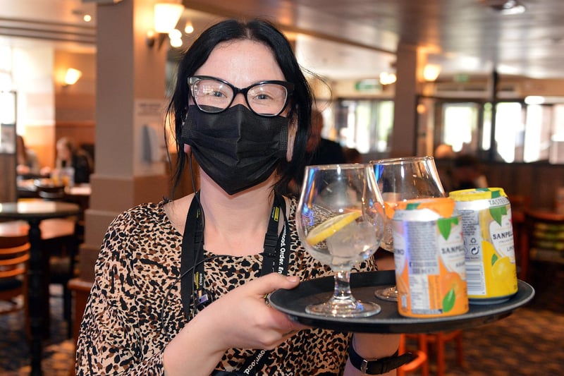 Dawn Sales takes drinks to a table at Chesterfield Spa Lane Vaults this morning.