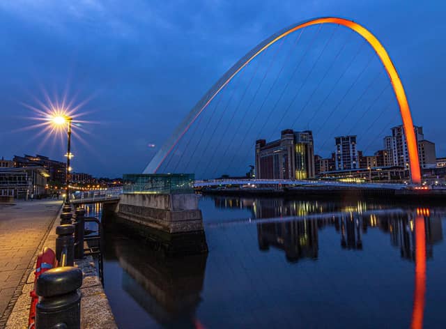 Gateshead Millennium Bridge glows orange on International Batten Disease Awareness Day. Photo credit: Stephen Moran, STM Photography.