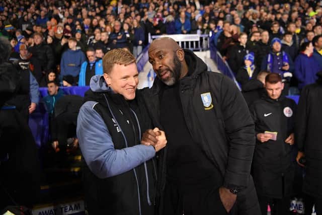 Eddie Howe, Manager of Newcastle United interacts with Darren Moore, Manager of Sheffield Wednesday prior to the Emirates FA Cup Third Round match between Sheffield Wednesday and Newcastle United at Hillsborough on January 07, 2023 in Sheffield, England. (Photo by Laurence Griffiths/Getty Images)