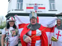 Dougie's Tavern manager Norman Scott, centre, gets ready for St George's Day with Emma Scott and Bobby Park.