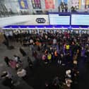 People, some who have fled Ukraine, line up at a ticket counter at the train station in Warsaw, Poland, March 13, 2022. (AP Photo/Czarek Sokolowski, File)