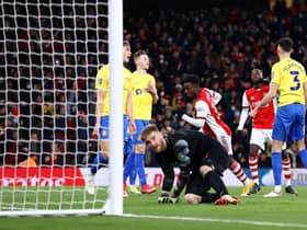 Eddie Nketiah of Arsenal scores their team's fourth goal and his hat-trick past Lee Burge of Sunderland. (Photo by Ryan Pierse/Getty Images)