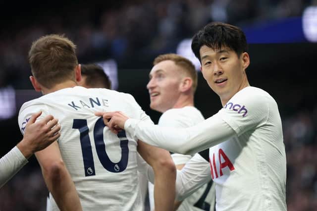 Heung-Min Son of Tottenham Hotspur celebrates with teammate Harry Kane after scoring their side's second goal during the Premier League match between Tottenham Hotspur and West Ham United at Tottenham Hotspur Stadium on March 20, 2022 in London, England. (Photo by Eddie Keogh/Getty Images)