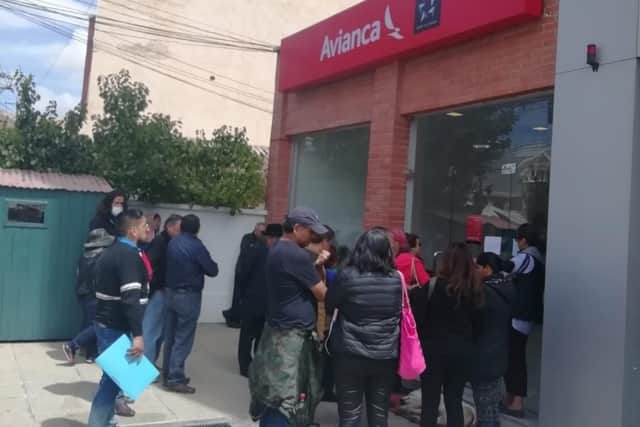 Tourists try to get flights home in La Paz, Bolivia.