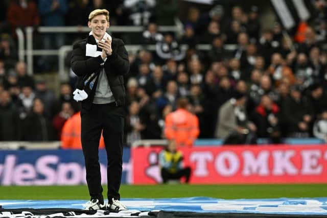 Newcastle United's new recruit English forward Anthony Gordon applauds the fans prior to the start of the English League Cup semi final football match between Newcastle United and Southampton at St James's Park stadium in Newcastle, on January 31, 2023. (Photo by PAUL ELLIS/AFP via Getty Images)