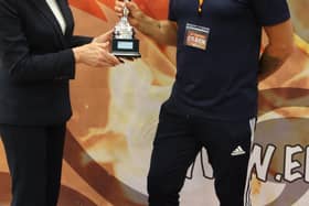 Dokan chief instructor Kevan Mitchinson collecting another top team award.
