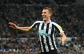 Newcastle player Dan Burn celebrates after scoring the opening goal during the Carabao Cup Quarter Final match between Newcastle United and Leicester City at St James' Park on January 10, 2023 in Newcastle upon Tyne, England. (Photo by Stu Forster/Getty Images)