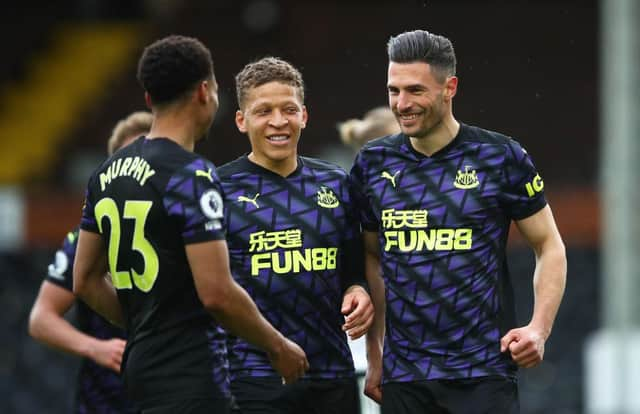 Dwight Gayle, centre, celebrates Fabian Schar's goal against Fulham on the final day of last season.