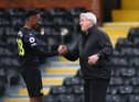 Steve Bruce manager of Newcastle United with Joe Willock after the Premier League match between Fulham and Newcastle United at Craven Cottage on May 23, 2021 in London, United Kingdom.