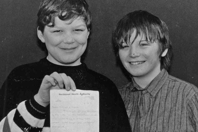 Mark Power (left) and David Proffitt from Central Estate, pictured with a receipt from Hartlepool General Hospital following their donation of £10 to the children's ward.  The money is the proceeds from a jumble sale the boys held 30 years ago this month.
