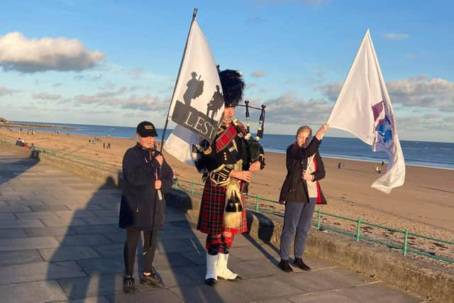 The fundraising marchers going by the seafront