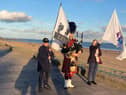 The fundraising marchers going by the seafront