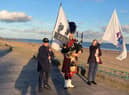 The fundraising marchers going by the seafront