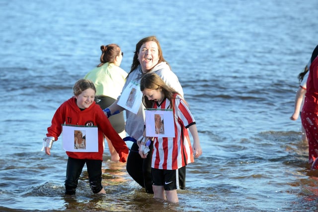 Young fundraisers take part in the annual Cancer Connections Boxing Day dip at Littlehaven Beach