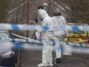 Forensic officers from Police Service of Northern Ireland (PSNI) at the sports complex in the Killyclogher Road area of Omagh