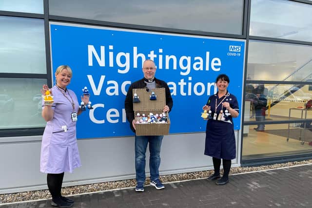 Emma, matron at the Nightingale Vaccination Centre (left) with Reverend Paul Barker (centre) and Carol Robson, who were delivering the angels