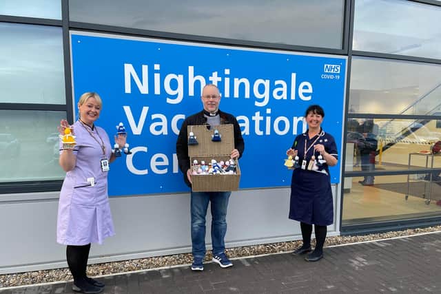 Emma, matron at the Nightingale Vaccination Centre (left) with Reverend Paul Barker (centre) and Carol Robson, who were delivering the angels