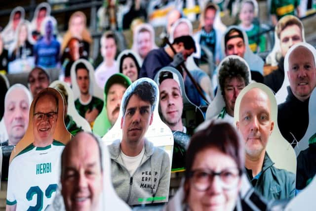 Cardboard cutouts with portraits of Borussia Moenchegladbach's supporters are seen at the Borussia Park football stadium in Moenchengladbach, Germany.