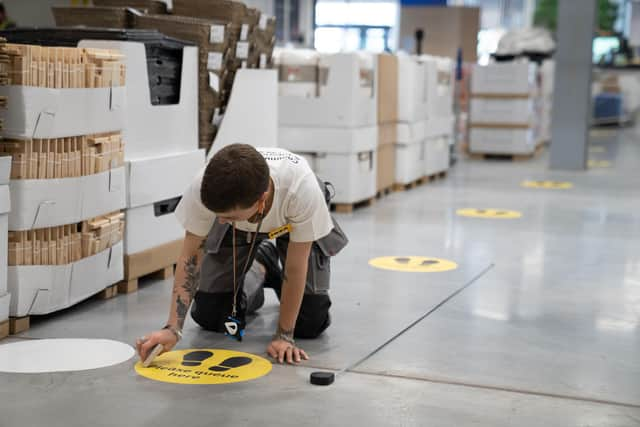 Co-workers finalising the safety measures that are being put in place ahead of 19 stores reopening in England and Northern Ireland on June 1.