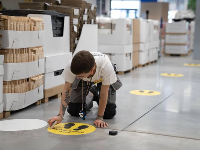 Co-workers finalising the safety measures that are being put in place ahead of 19 stores reopening in England and Northern Ireland on June 1.