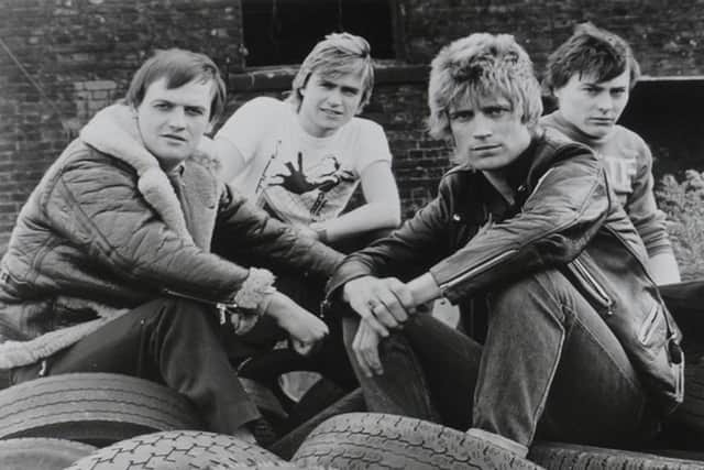 A young Mensi, left, with the other Angelic Upstarts.