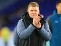 Newcastle United head coach Eddie Howe applauds fans.