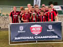 The team celebrating their win