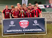 The team celebrating their win