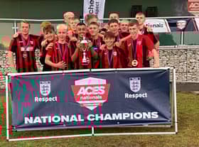The team celebrating their win