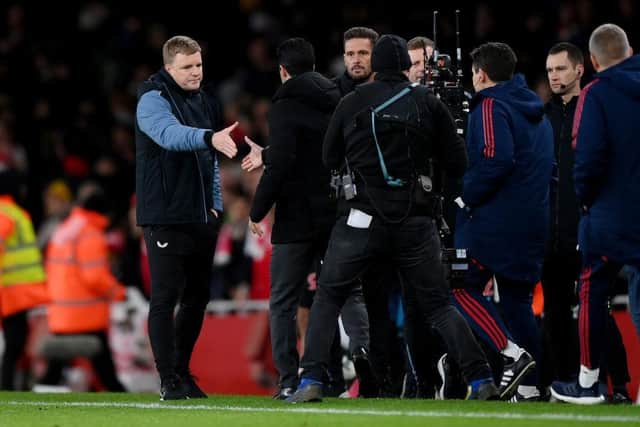 Eddie Howe and Mikel Arteta shake hands at the end of the game.