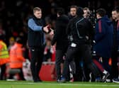 Eddie Howe and Mikel Arteta shake hands at the end of the game.