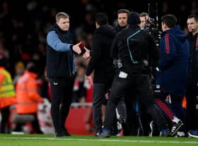 Eddie Howe and Mikel Arteta shake hands at the end of the game.