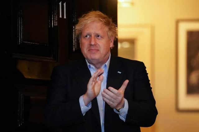 Boris Johnson takes part in the national clap for care workers shortly before being taken into hospital