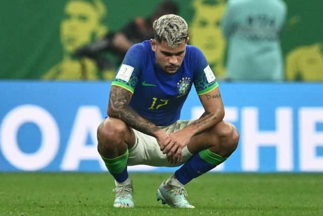 Brazil's midfielder #17 Bruno Guimaraes reacts to their defeat on the pitch after during the Qatar 2022 World Cup Group G football match between Cameroon and Brazil at the Lusail Stadium in Lusail, north of Doha on December 2, 2022. (Photo by Jewel SAMAD / AFP) (Photo by JEWEL SAMAD/AFP via Getty Images)