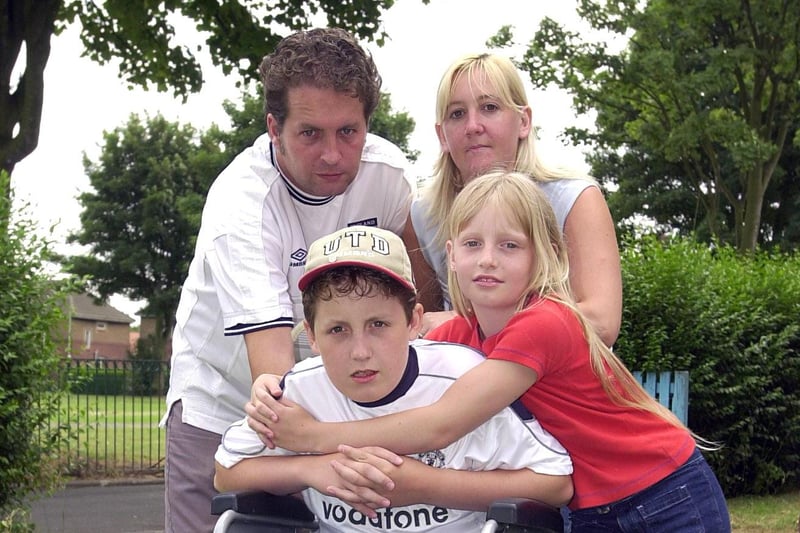 Lloyd Rodgers, aged 12, got a hug from his sister Laura Rodgers, aged nine, while his mum Teresa Morris, and his step dad Simon Morris looked on in 2001