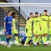 Paul Dummett of Newcastle United celebrates with Miguel Almiron, Federico Fernandez and Joe Willock after scoring his team's second goal during the Premier League match between Leicester City and Newcastle United at The King Power Stadium on May 07, 2021 in Leicester, England.