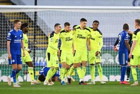 Paul Dummett of Newcastle United celebrates with Miguel Almiron, Federico Fernandez and Joe Willock after scoring his team's second goal during the Premier League match between Leicester City and Newcastle United at The King Power Stadium on May 07, 2021 in Leicester, England.