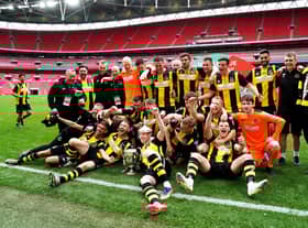 Hebburn Town players and staff celebrate with the Buildbase FA Vase 2019/20 Trophy after the Final at Wembley Stadium, London.