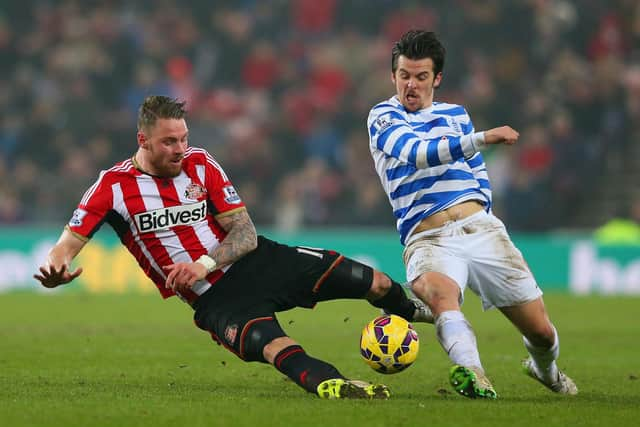 SUNDERLAND, ENGLAND - FEBRUARY 10:  Connor Wickham of Sunderland and Joey Barton of QPR battle for the ball during the Barclays Premier League match between Sunderland and Queens Park Rangers at Stadium of Light on February 10, 2015 in Sunderland, England.  (Photo by Alex Livesey/Getty Images)