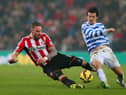 SUNDERLAND, ENGLAND - FEBRUARY 10:  Connor Wickham of Sunderland and Joey Barton of QPR battle for the ball during the Barclays Premier League match between Sunderland and Queens Park Rangers at Stadium of Light on February 10, 2015 in Sunderland, England.  (Photo by Alex Livesey/Getty Images)