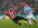 SUNDERLAND, ENGLAND - FEBRUARY 10:  Connor Wickham of Sunderland and Joey Barton of QPR battle for the ball during the Barclays Premier League match between Sunderland and Queens Park Rangers at Stadium of Light on February 10, 2015 in Sunderland, England.  (Photo by Alex Livesey/Getty Images)