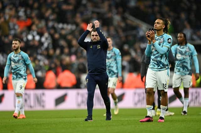 Nathan Jones, Manager of Southampton, and Sekou Mara of Southampton applaud the fans following their defeat in the Carabao Cup Semi Final 2nd Leg match between Newcastle United and Southampton at St James' Park on January 31, 2023 in Newcastle upon Tyne, England. (Photo by Gareth Copley/Getty Images)