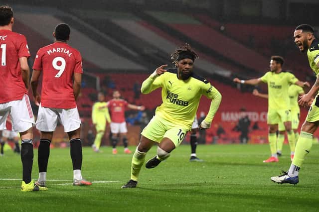 MANCHESTER, ENGLAND - FEBRUARY 21: Allan Saint-Maximin of Newcastle celebrates his goal during the Premier League match between Manchester United and Newcastle United at Old Trafford on February 21, 2021 in Manchester, England. Sporting stadiums around the UK remain under strict restrictions due to the Coronavirus Pandemic as Government social distancing laws prohibit fans inside venues resulting in games being played behind closed doors. (Photo by Stu Forster/Getty Images)