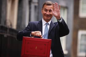 Chancellor Jeremy Hunt leaves Downing Street to present his spring budget to parliament. He is doing nothing to help our community, says Kate.