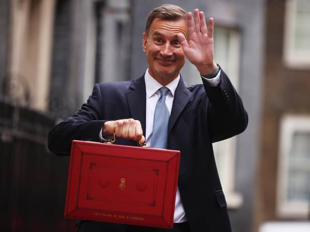 Chancellor Jeremy Hunt leaves Downing Street to present his spring budget to parliament. He is doing nothing to help our community, says Kate.