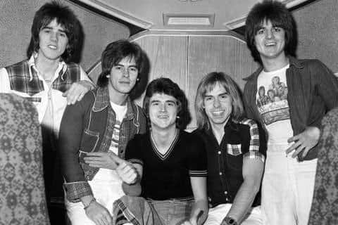 File photo of The Bay City Rollers (left to right) Stuart Wood, Alan Longmuir, Leslie Mckeown, Derek Longmuir, and Eric Faulkner on board a jumbo jet at London's Heathrow Airport in 1975 before leaving for Perth and a tour of Australia