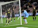 Ellis Simms scores at the DW Stadium earlier this season
